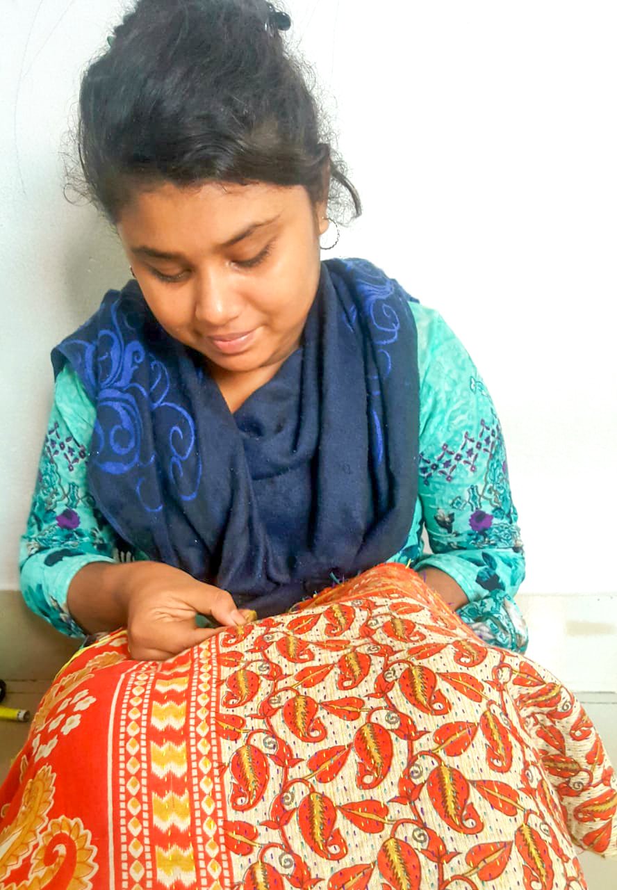 Upcycled sari clutch with kantha stitch