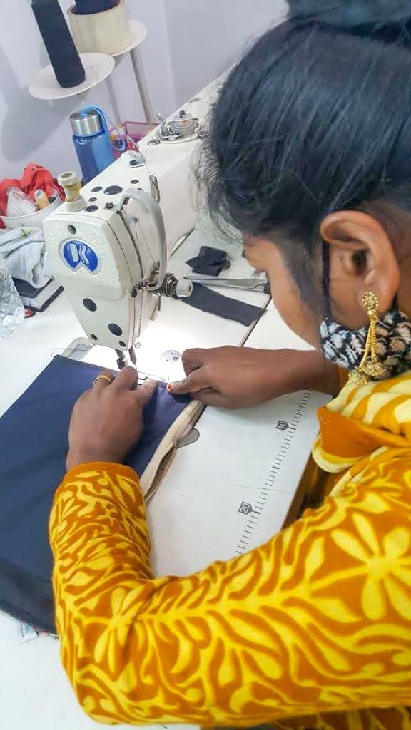 Upcycled sari clutch with kantha stitch