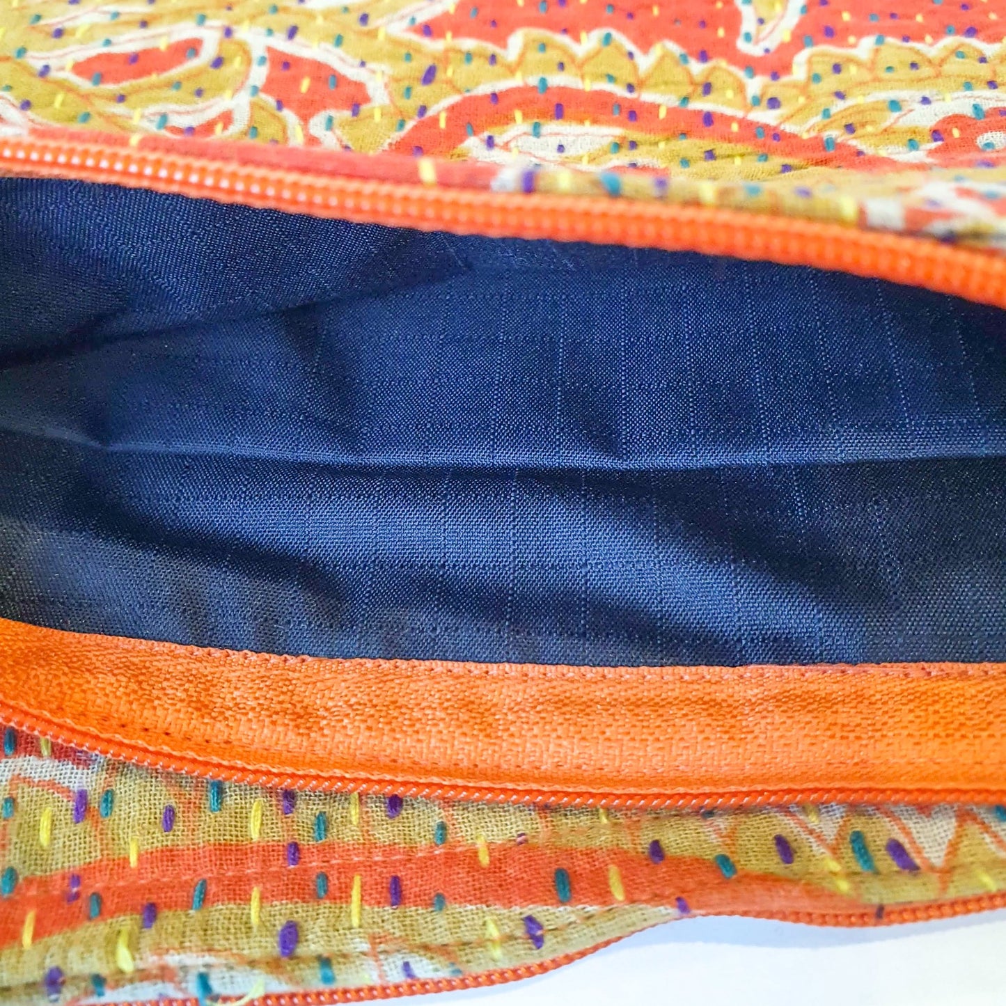 Upcycled sari clutch with kantha stitch