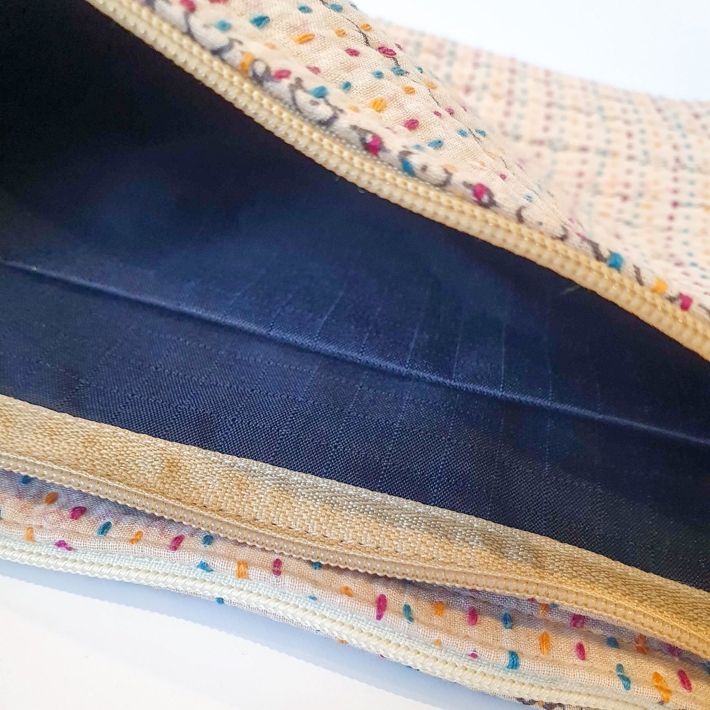 Upcycled sari clutch with kantha stitch