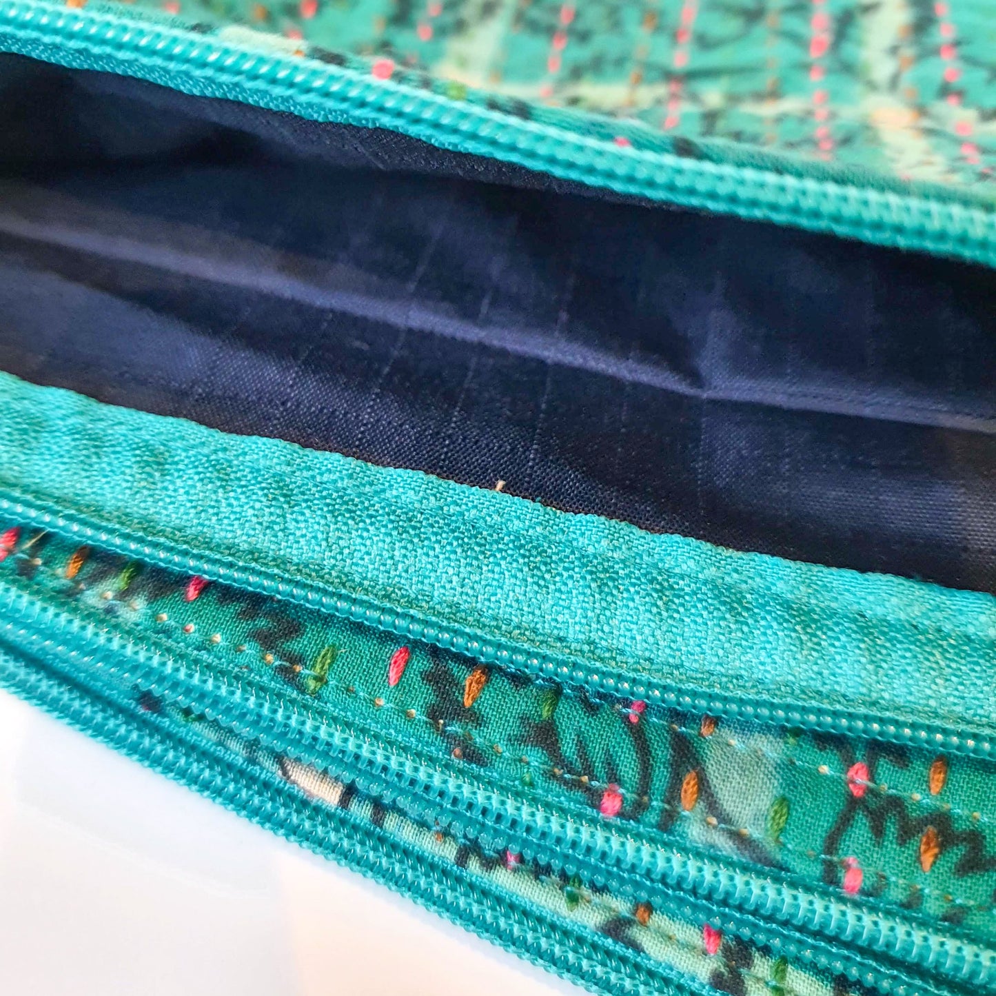 Upcycled sari clutch with kantha stitch