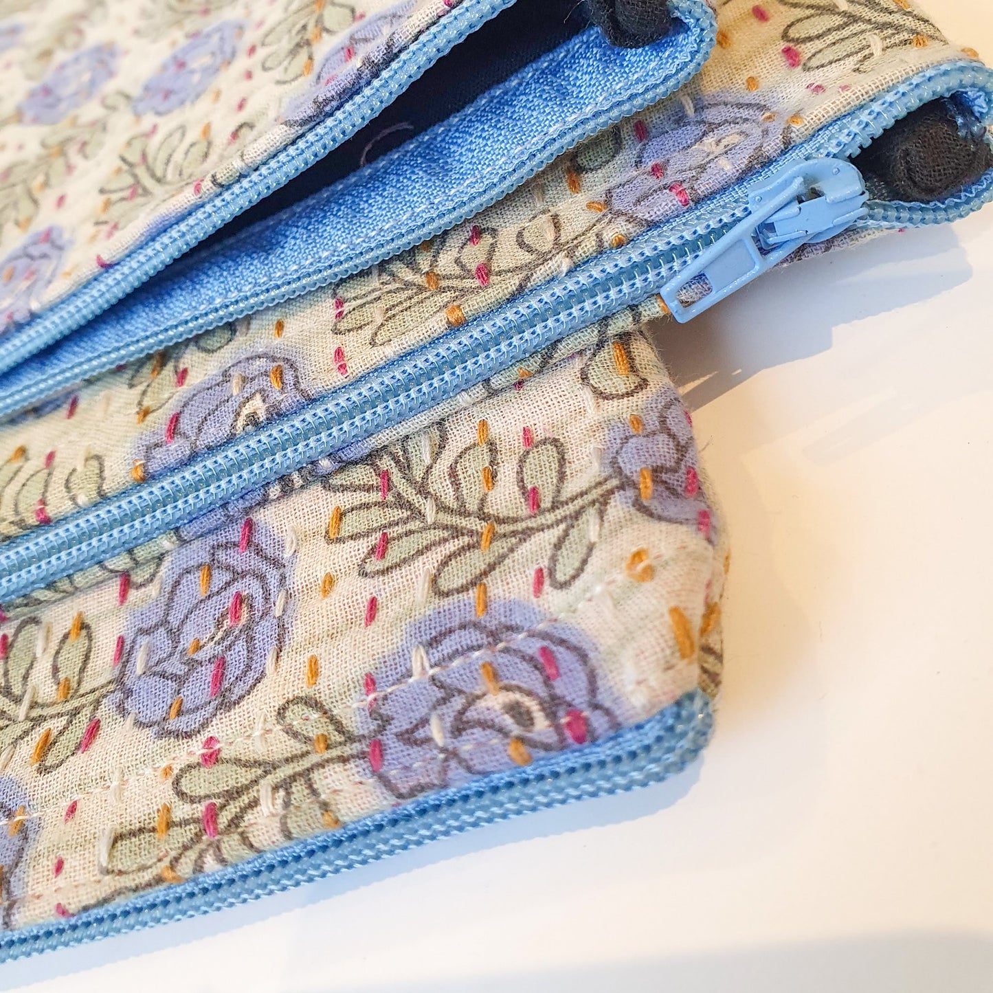 Upcycled sari clutch with kantha stitch