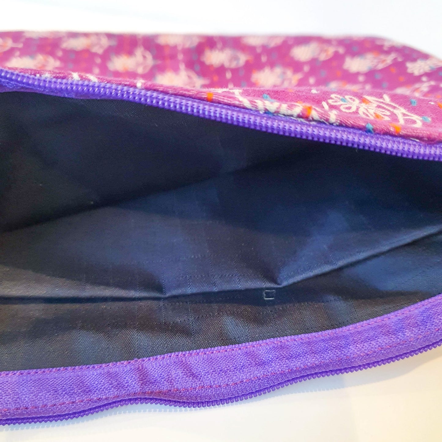 Upcycled sari clutch with kantha stitch